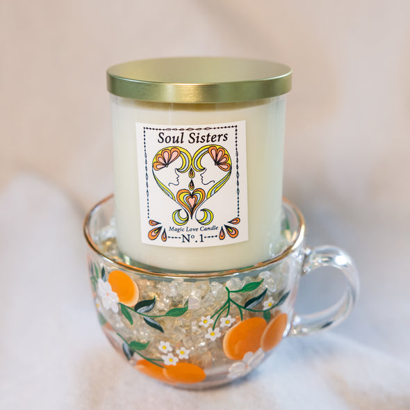 Soul Sisters Magic Love Candle — Reiki-infused 8 oz luxury apricot-coconut wax candle with gold lid, featuring gardenia, tuberose, and orange blossom fragrance.