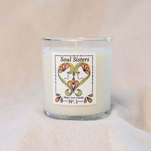 Soul Sisters Magic Love Candle — Reiki-infused 8 oz luxury apricot-coconut wax candle with gold lid, featuring gardenia, tuberose, and orange blossom fragrance.