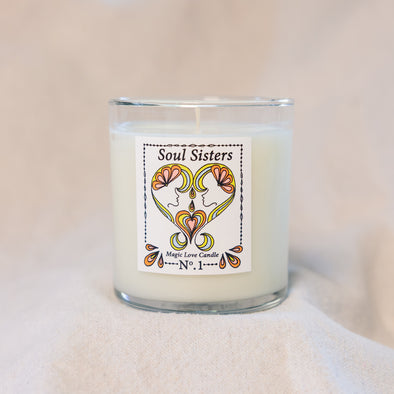 Soul Sisters Magic Love Candle — Reiki-infused 8 oz luxury apricot-coconut wax candle with gold lid, featuring gardenia, tuberose, and orange blossom fragrance.