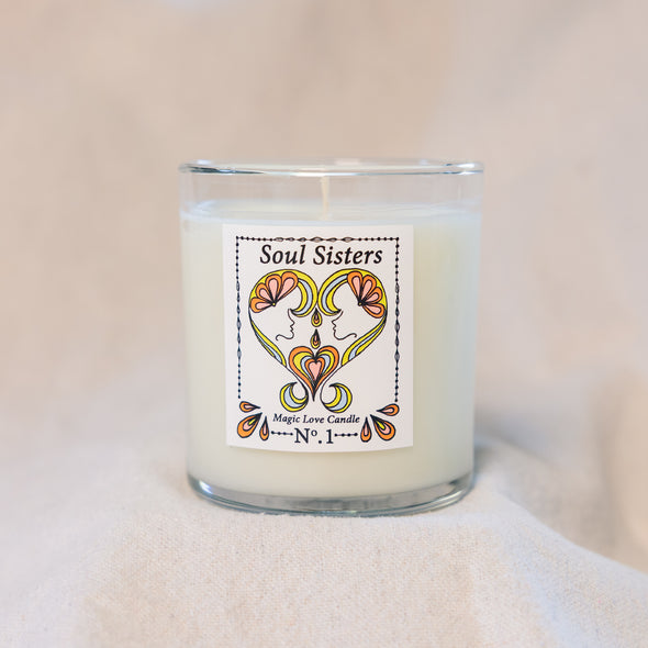 Soul Sisters Magic Love Candle — Reiki-infused 8 oz luxury apricot-coconut wax candle with gold lid, featuring gardenia, tuberose, and orange blossom fragrance.