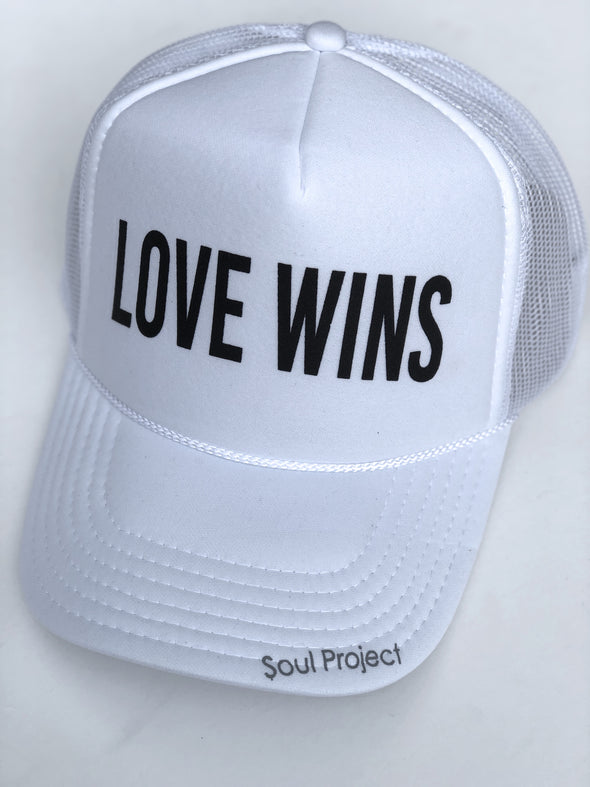 Love Wins trucker hat, hand printed in Laguna Beach CA at The Soul Project  100% Polyester Front, 100% Nylon Mesh Back 5-panel cap Plastic Adjustable Back Snap