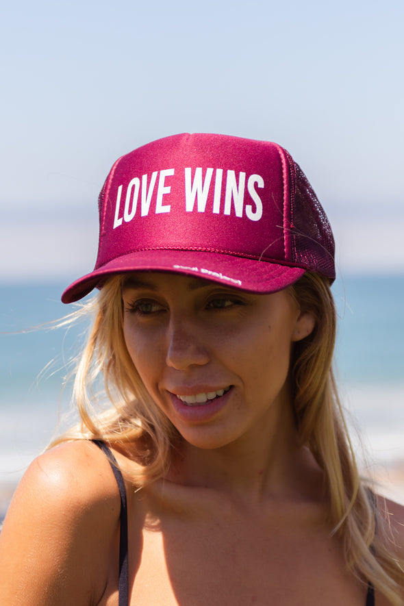 Love Wins trucker hat, hand printed in Laguna Beach CA at The Soul Project  100% Polyester Front, 100% Nylon Mesh Back 5-panel cap Plastic Adjustable Back Snap