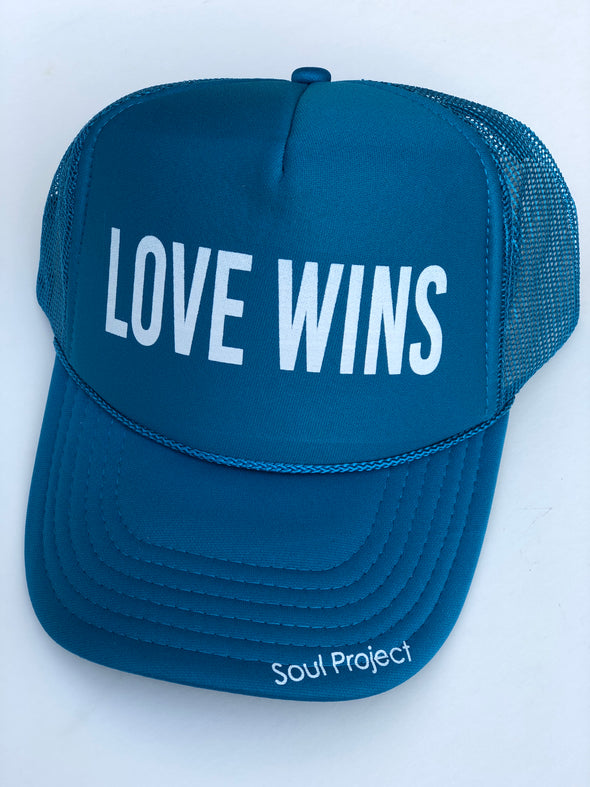 Love Wins trucker hat, hand printed in Laguna Beach CA at The Soul Project  100% Polyester Front, 100% Nylon Mesh Back 5-panel cap Plastic Adjustable Back Snap