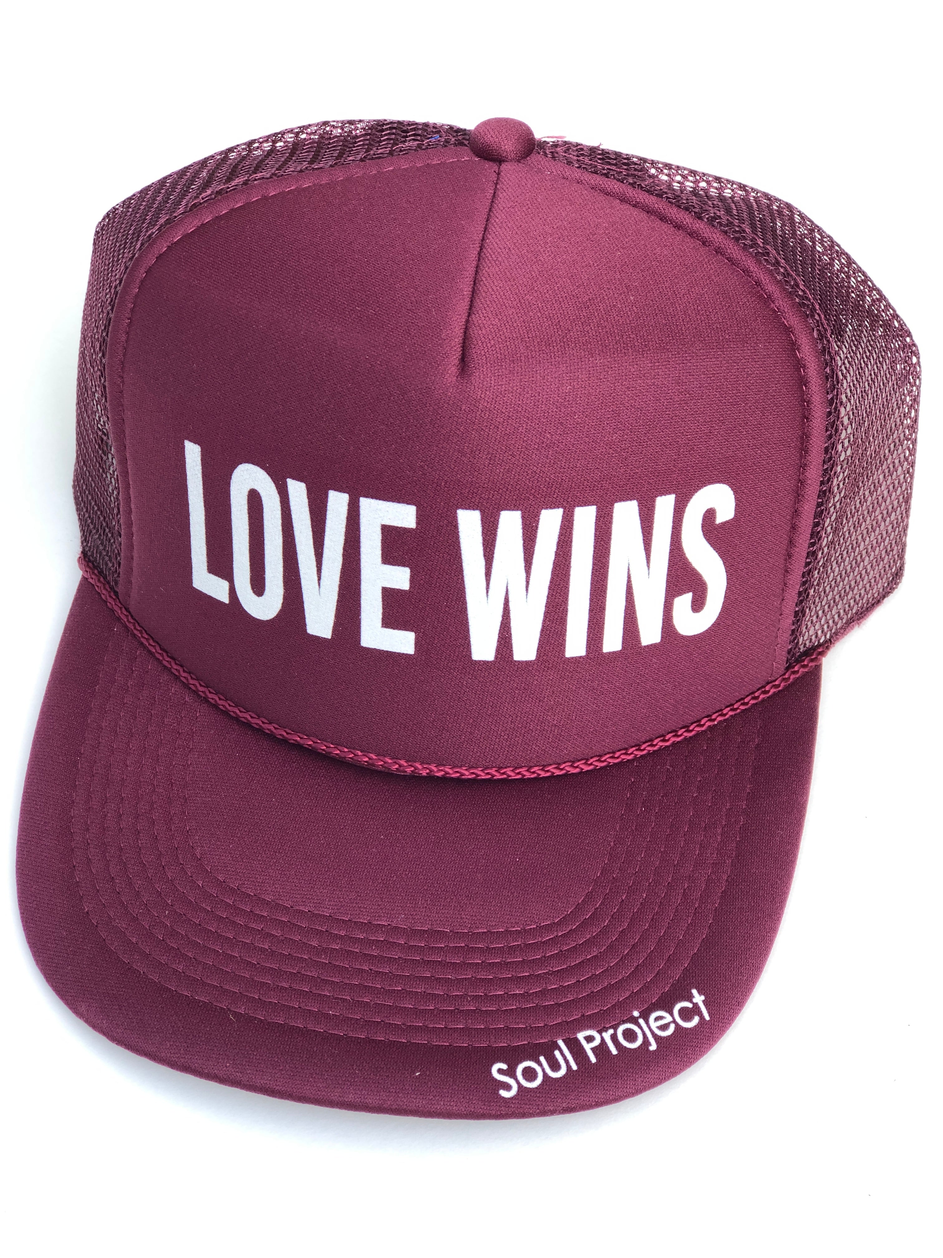 Love Wins trucker hat, hand printed in Laguna Beach CA at The Soul Project  100% Polyester Front, 100% Nylon Mesh Back 5-panel cap Plastic Adjustable Back Snap