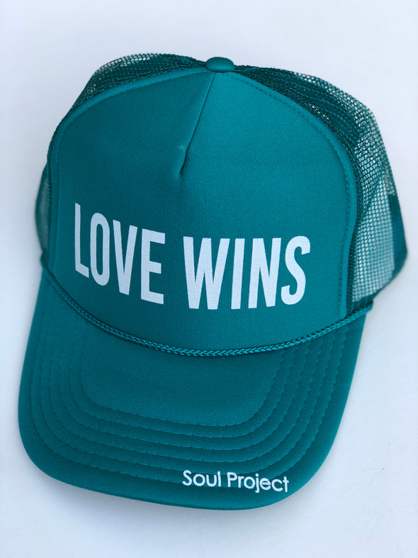 Love Wins trucker hat, hand printed in Laguna Beach CA at The Soul Project  100% Polyester Front, 100% Nylon Mesh Back 5-panel cap Plastic Adjustable Back Snap