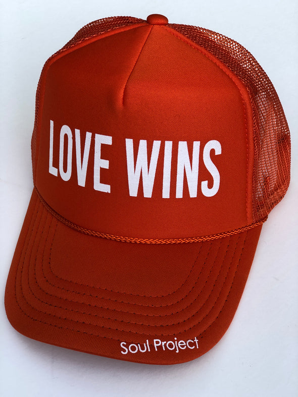 Love Wins trucker hat, hand printed in Laguna Beach CA at The Soul Project  100% Polyester Front, 100% Nylon Mesh Back 5-panel cap Plastic Adjustable Back Snap