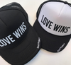 Love Wins trucker hat, hand printed in Laguna Beach CA at The Soul Project  100% Polyester Front, 100% Nylon Mesh Back 5-panel cap Plastic Adjustable Back Snap